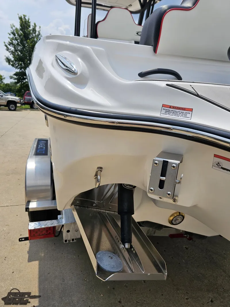 Slide: The Image of 2024 Glasstream 280 Pro GSX boat stern with trim tab and trailer. - 43