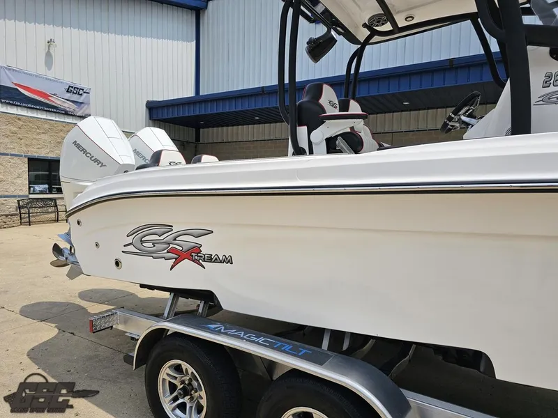 Slide: The Image of 2024 Glasstream 280 Pro GSX boat on a trailer outside a building. - 9