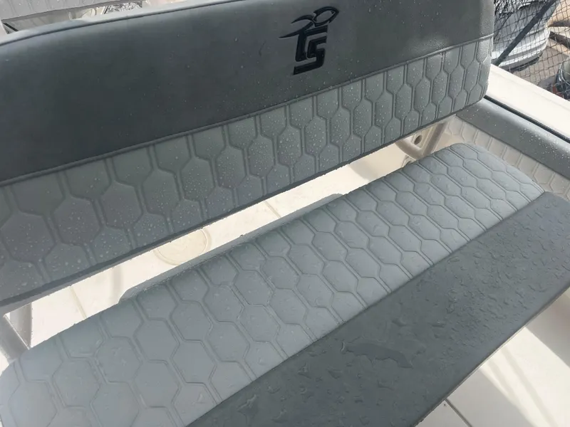 Slide: The Image of 2025 Sea Chaser 22 HFC boat seat with hexagonal pattern and logo. - 16