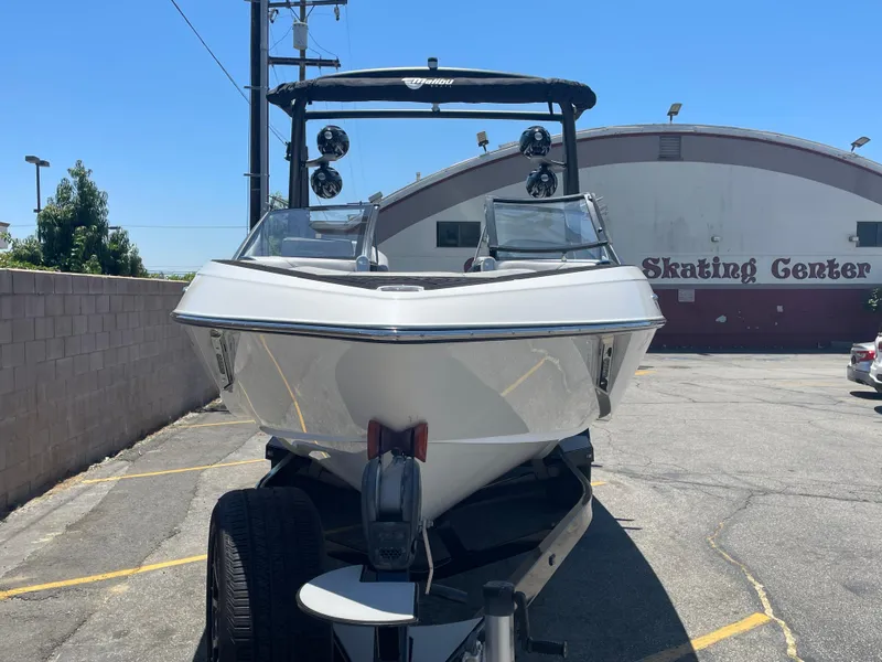 Slide: The Image of 2017 Malibu Wakesetter 25 LSV boat on trailer in parking lot. - 1