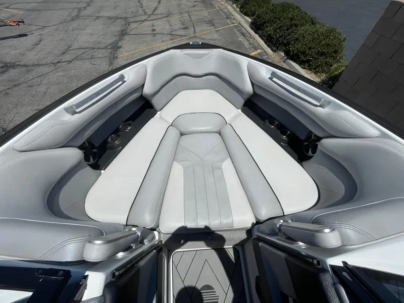 Slide: The Image of 2017 Malibu Wakesetter 25 LSV boat interior with gray seating. - 13
