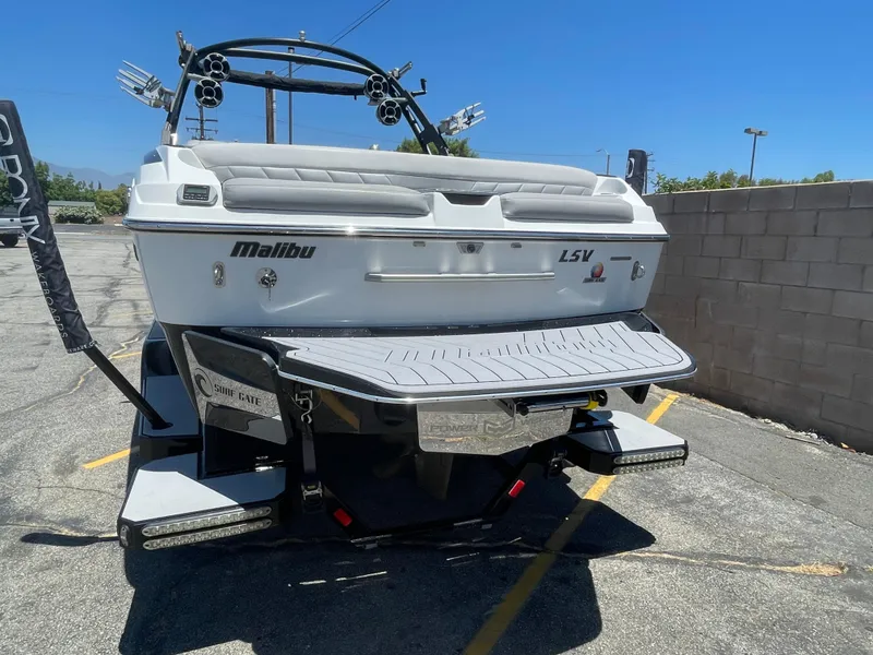 Slide: The Image of 2017 Malibu Wakesetter 25 LSV boat, rear view, parked on a trailer. - 3