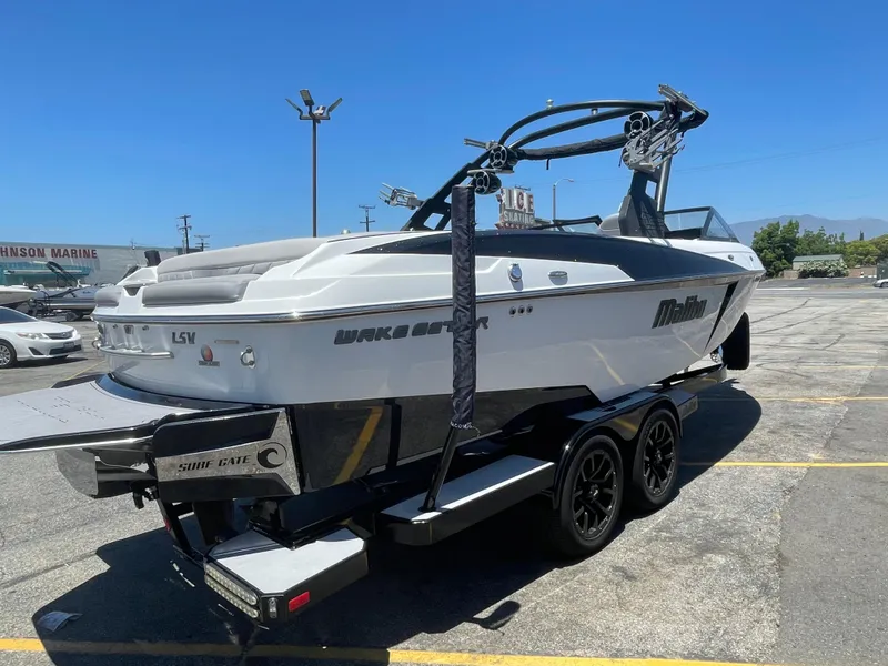 Slide: The Image of 2017 Malibu Wakesetter 25 LSV boat on trailer in parking lot. - 4