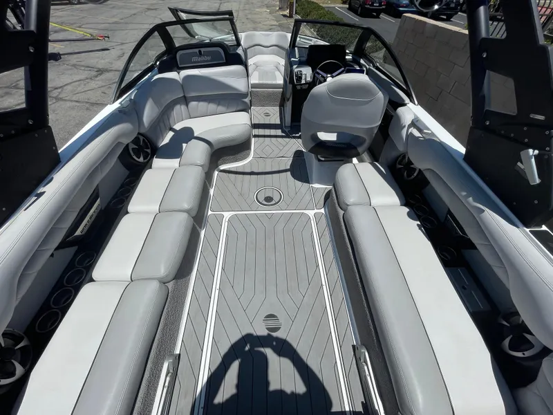 Slide: The Image of 2017 Malibu Wakesetter 25 LSV interior with spacious seating and modern design. - 7