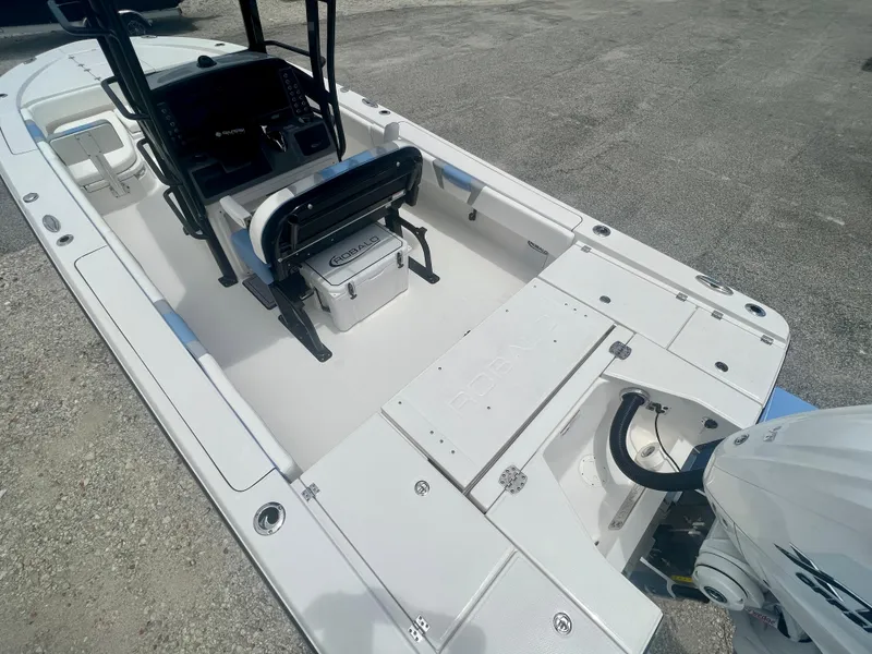 Slide: The Image of 2025 Robalo 266 Cayman SD boat interior with console and seating. - 10