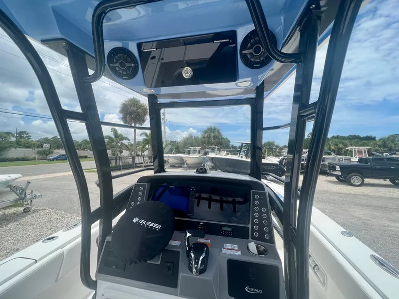 Slide: The Image of 2025 Robalo 266 Cayman SD boat console with advanced controls and navigation system. - 16