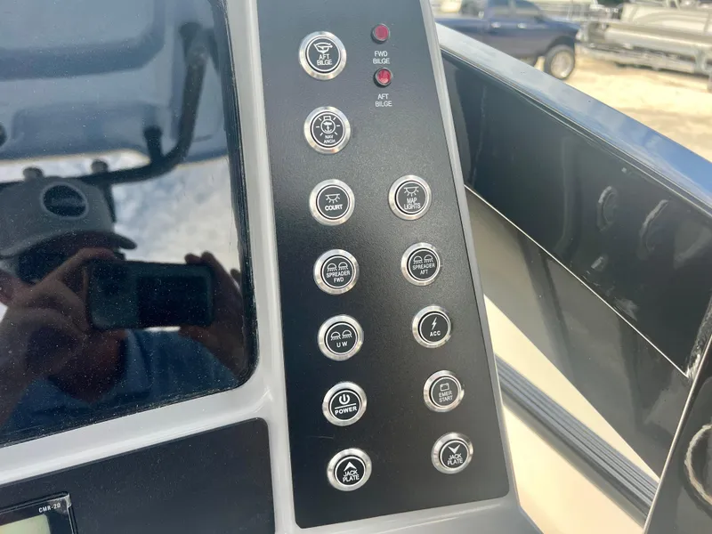 Slide: The Image of Control panel of the 2025 Robalo 266 Cayman SD boat with various function buttons. - 17