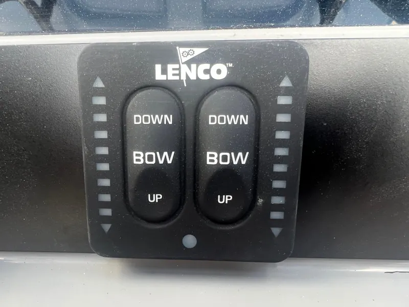 Slide: The Image of Lenco trim tab control panel on a 2025 Robalo 266 Cayman SD boat. - 19