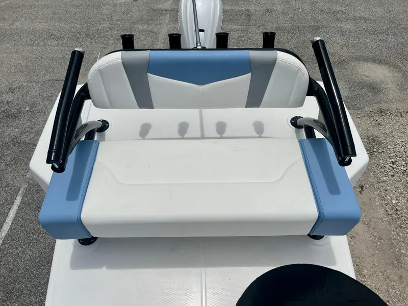 Slide: The Image of 2025 Robalo 266 Cayman SD boat seating with blue and white upholstery. - 37