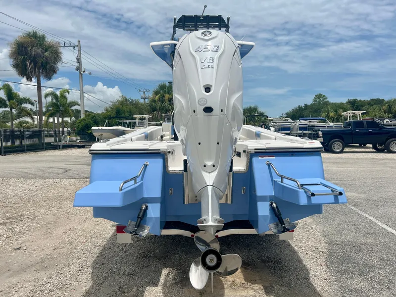 Slide: The Image of 2025 Robalo 266 Cayman SD boat with powerful outboard motor, rear view. - 7