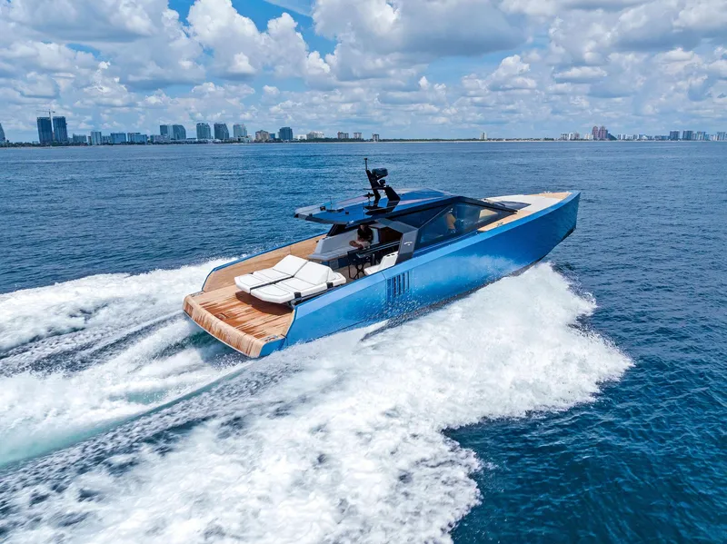 Slide: The Image of 2023 Wally WALLYPOWER58 yacht cruising on open water under a blue sky. - 11
