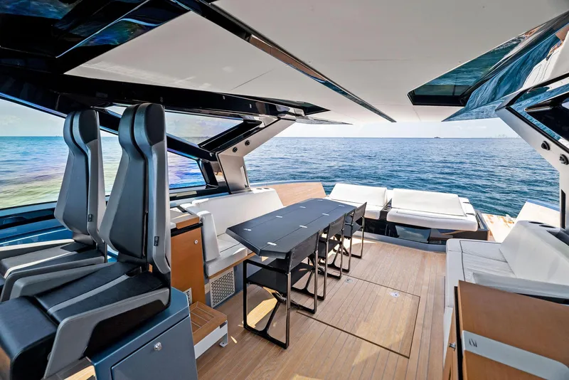 Slide: The Image of Luxurious 2023 Wally WALLYPOWER58 yacht interior with sleek seating and ocean view. - 16