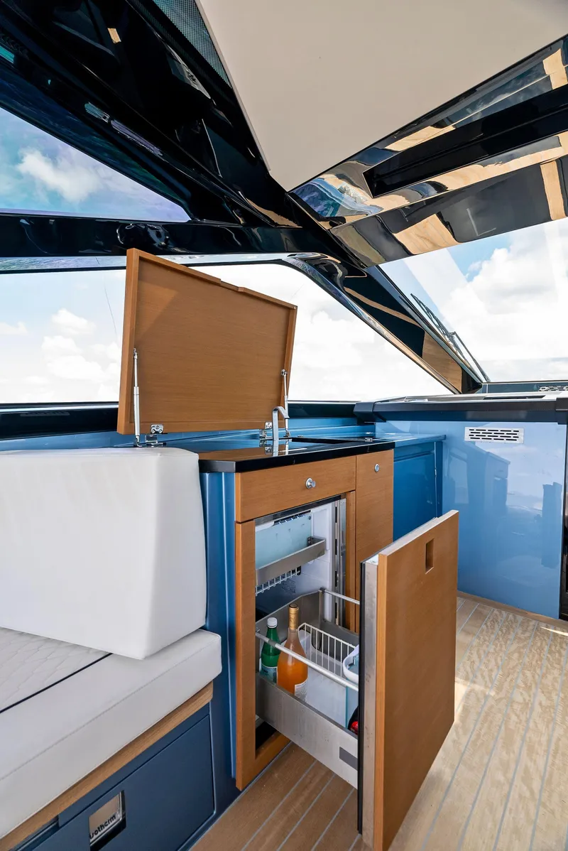 Slide: The Image of Luxurious 2023 Wally WALLYPOWER58 yacht interior with modern kitchenette and sleek design. - 20