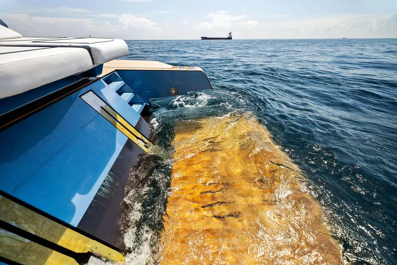 Slide: The Image of 2023 Wally WALLYPOWER58 yacht cruising on open sea with distant ship. - 23