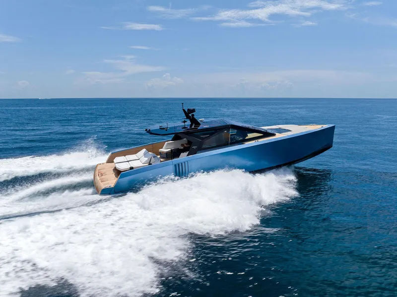 The Image of 2023 Wally WALLYPOWER58 yacht cruising on open sea under clear blue sky. - 4