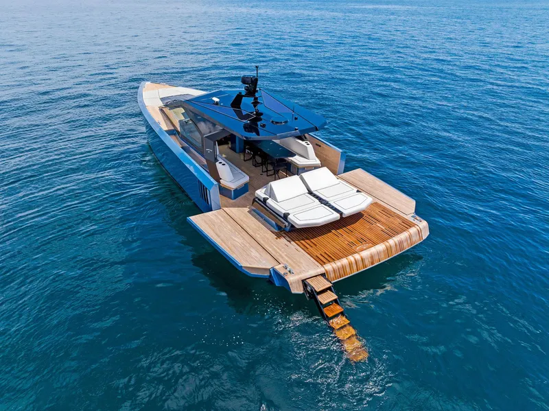 Slide: The Image of 2023 Wally WALLYPOWER58 yacht with sleek design and spacious deck on open water. - 9