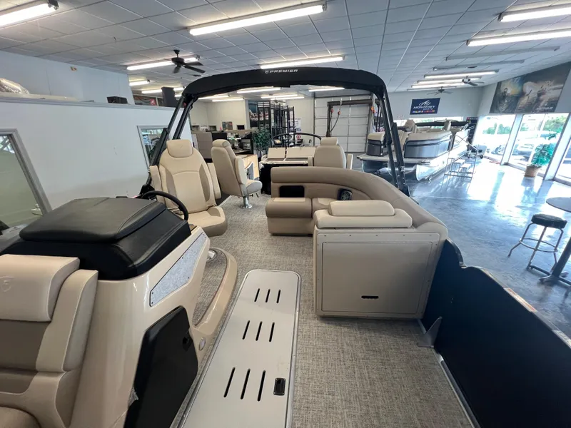 Slide: The Image of 2025 Premier Sunsation 230 Angler pontoon boat interior in showroom. - 14