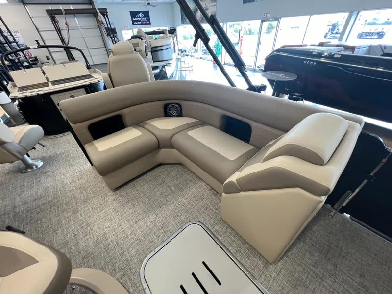 Slide: The Image of Interior seating of 2025 Premier Sunsation 230 Angler pontoon boat in showroom. - 16