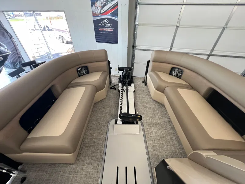 Slide: The Image of 2025 Premier Sunsation 230 Angler interior with beige seating and modern design. - 19