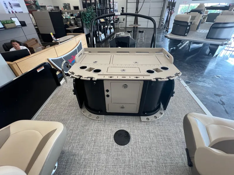 Slide: The Image of 2025 Premier Sunsation 230 Angler boat interior with seating and storage compartments. - 7