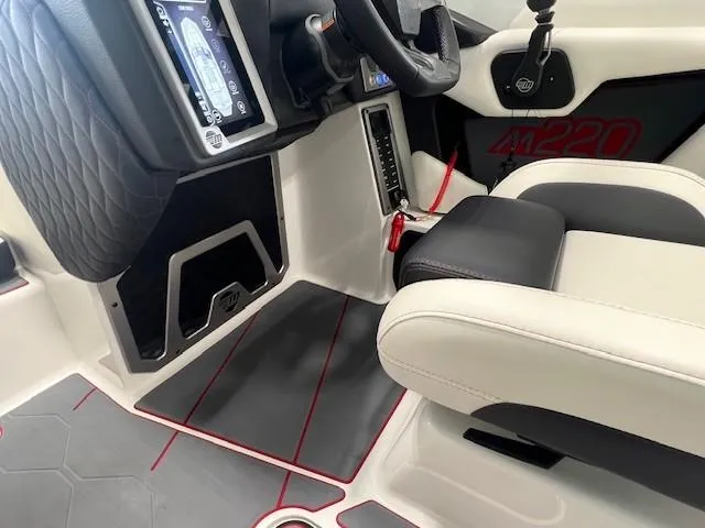 Slide: The Image of 2024 Malibu M220 boat interior with modern dashboard and comfortable seating. - 12