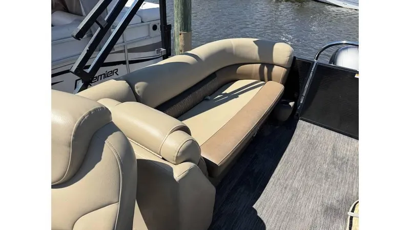 Slide: The Image of 2020 Godfrey SWEETWATER 2286 MT boat with beige seating, docked by the water. - 4