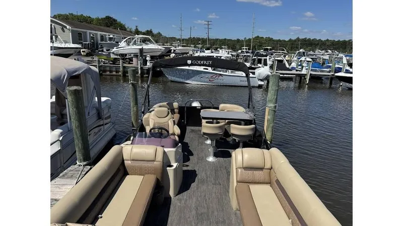 Slide: The Image of 2020 Godfrey SWEETWATER 2286 MT pontoon boat docked at marina. - 5
