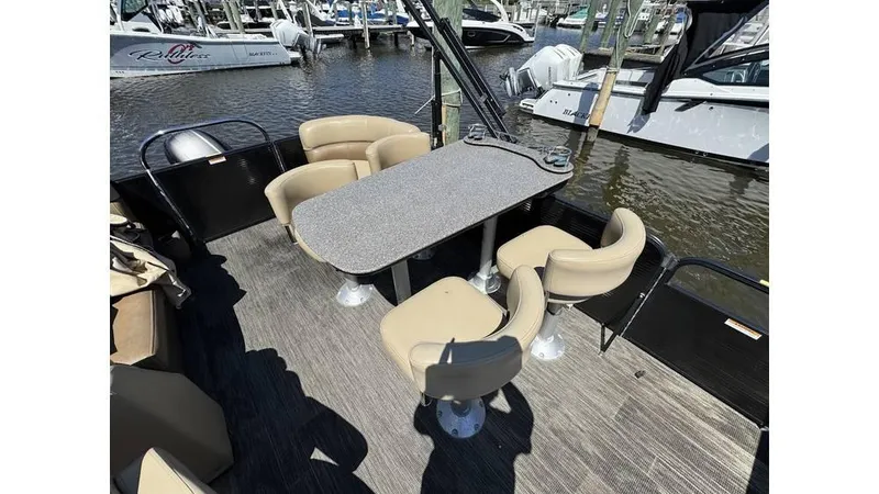 Slide: The Image of 2020 Godfrey SWEETWATER 2286 MT pontoon boat interior with table and seating. - 9
