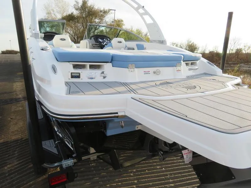 Slide: The Image of 2024 Chaparral 21 Surf boat rear view with swim platform and seating. - 3