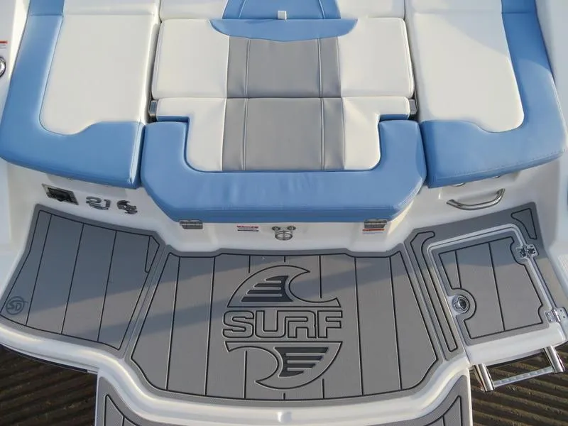 Slide: The Image of 2024 Chaparral 21 Surf boat rear seating and deck with logo. - 5