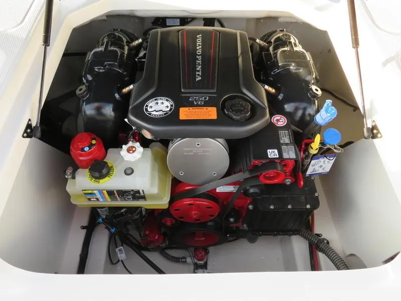 Slide: The Image of 2024 Chaparral 21 Surf boat engine compartment with Volvo Penta 250 V6 engine. - 7