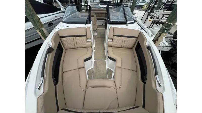 Slide: The Image of 2016 Sea Ray 280 SLX boat interior with tan leather seating and sleek design. - 4
