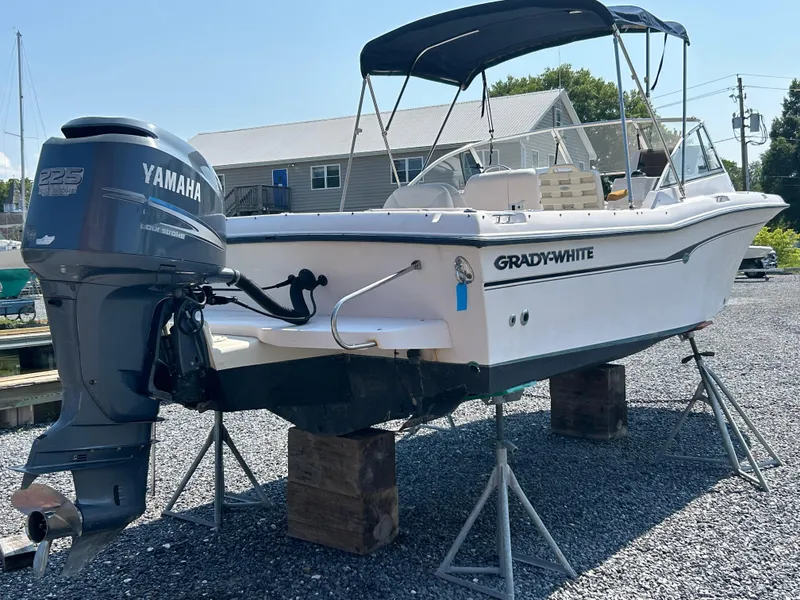 Slide: The Image of 2003 Grady-White Tournament 225 boat with Yamaha outboard motor on stands. - 10