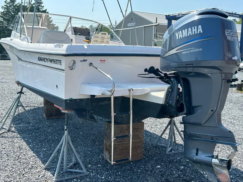Slide: The Image of 2003 Grady-White Tournament 225 boat with Yamaha outboard motor on stands. - 12