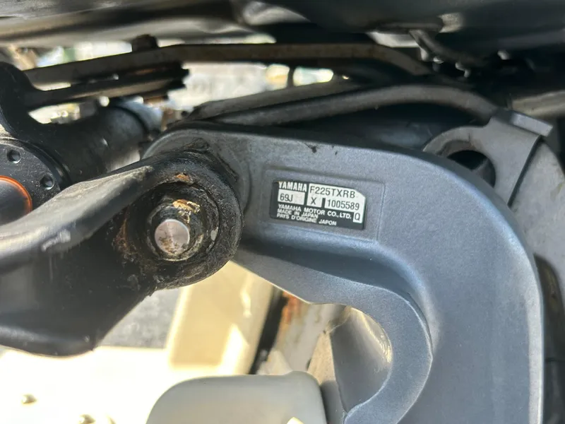 Slide: The Image of Close-up of Yamaha F225TXRB engine part on 2003 Grady-White Tournament 225 boat. - 9