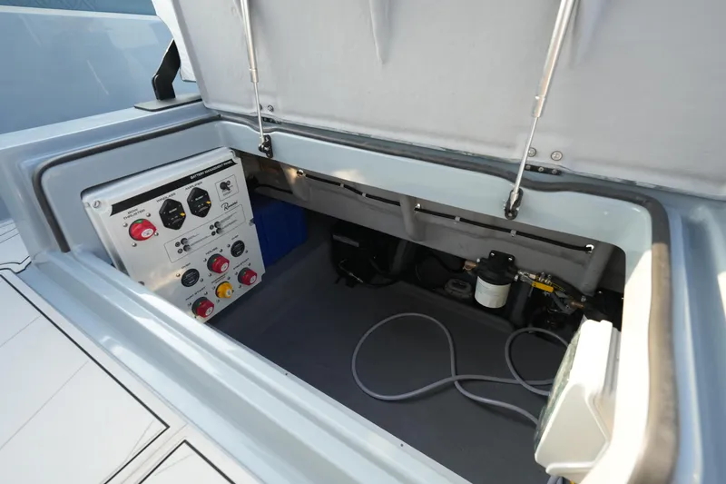 Slide: The Image of 2025 Ranieri Cayman 33 Executive boat control panel and storage compartment. - 17