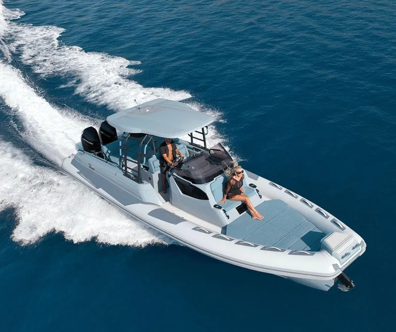 Slide: The Image of 2025 Ranieri Cayman 33 Executive cruising on open water. - 2