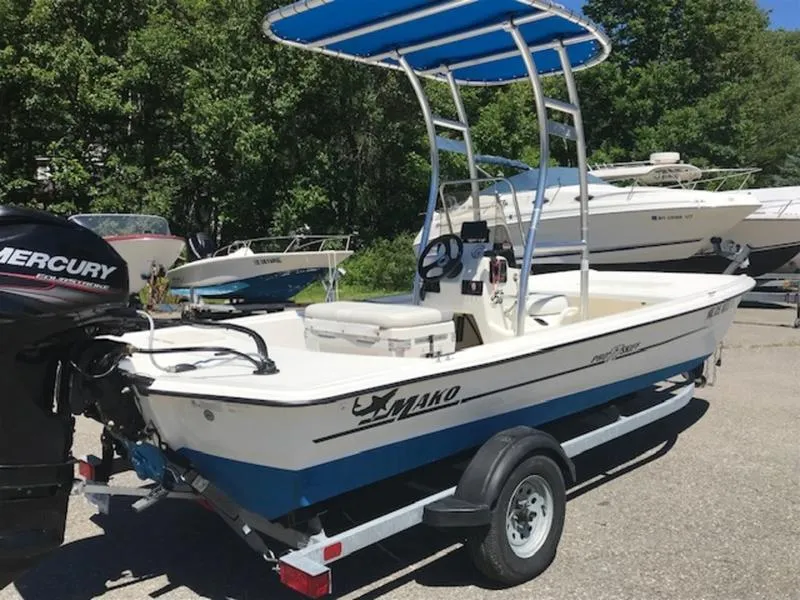 Slide: The Image of 2018 Mako 17 SKIFF CC boat on trailer with Mercury outboard motor. - 7