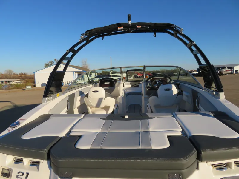 Slide: The Image of 2024 Chaparral 21 SSi boat interior with seating and wakeboard tower. - 10