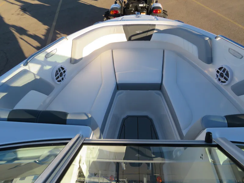 Slide: The Image of 2024 Chaparral 21 SSi boat interior with spacious seating and built-in speakers. - 16