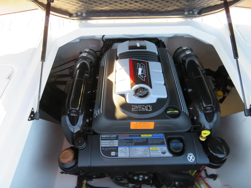 Slide: The Image of 2024 Chaparral 21 SSi boat engine compartment with a powerful 250 HP engine. - 17