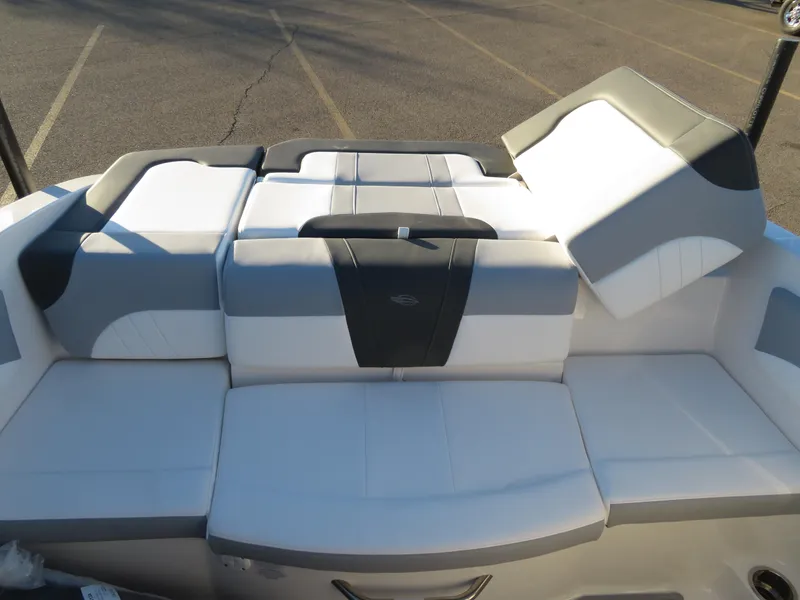 Slide: The Image of 2024 Chaparral 21 SSi boat interior seating with gray and white upholstery. - 19