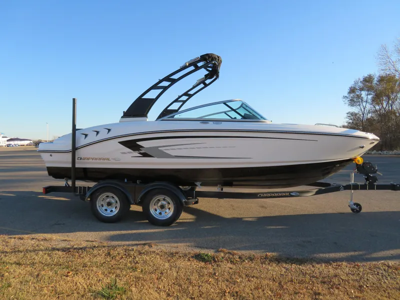 Slide: The Image of 2024 Chaparral 21 SSi boat on a trailer in a parking lot. - 4