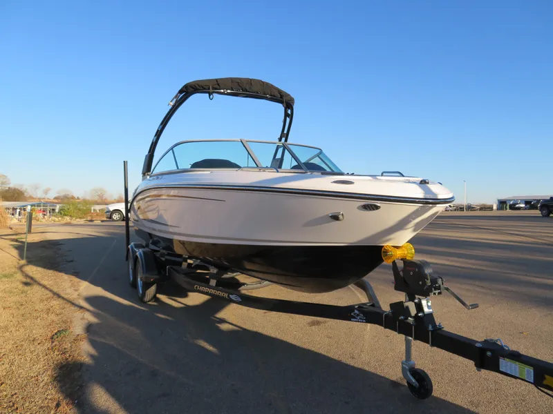 Slide: The Image of 2024 Chaparral 21 SSi boat on trailer in outdoor setting. - 5