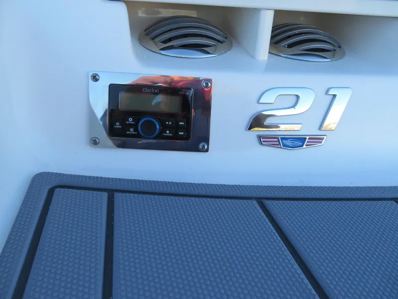Slide: The Image of 2024 Chaparral 21 SSi boat dashboard with Clarion audio system. - 6
