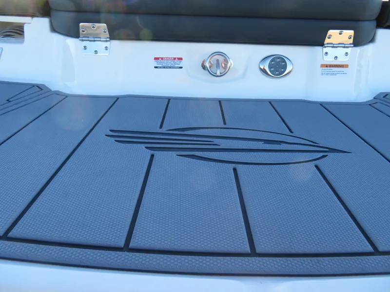 Slide: The Image of 2024 Chaparral 21 SSi boat deck with logo and control panel. - 7