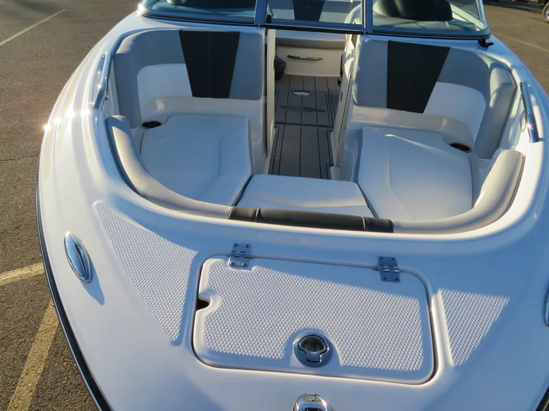 Slide: The Image of 2024 Chaparral 21 SSi boat interior with white and black seating. - 9