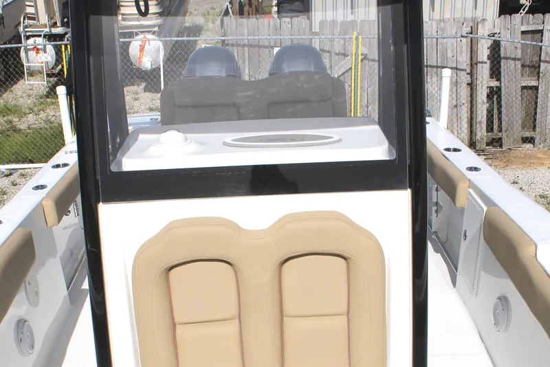 Slide: The Image of 2018 Sea Hunt 270 Gamefish boat interior with tan seating and console. - 5