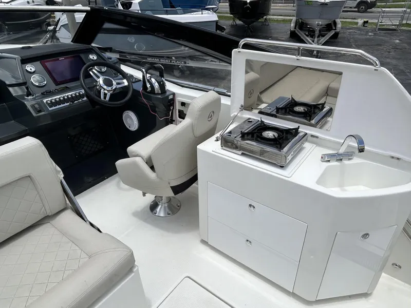 Slide: The Image of Interior cabin of 2023 Skamander 850 Voyager boat with wooden furnishings. - 12