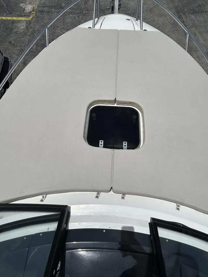 Slide: The Image of 2023 Skamander 850 Voyager cabin interior with wooden storage cabinet and drawers. - 15